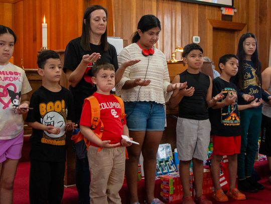 Church blesses students, eases back-to-school burden