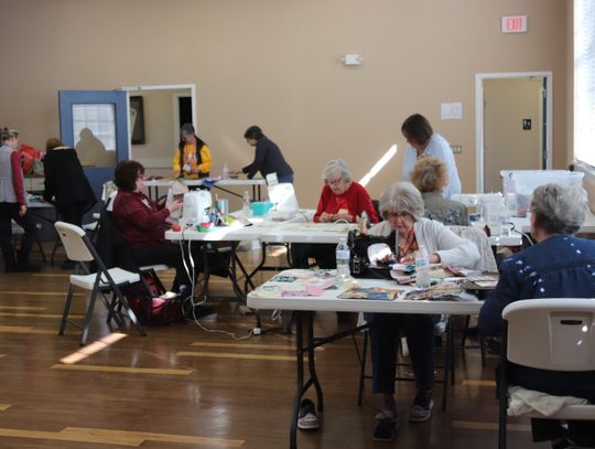 Various stations used in the charity quilt process