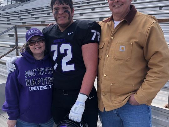 Wade Moore (Middle) taking a picture with his mom Melanie (left) and dad Todd after a game at Southwest Baptist University. Courtesy photo