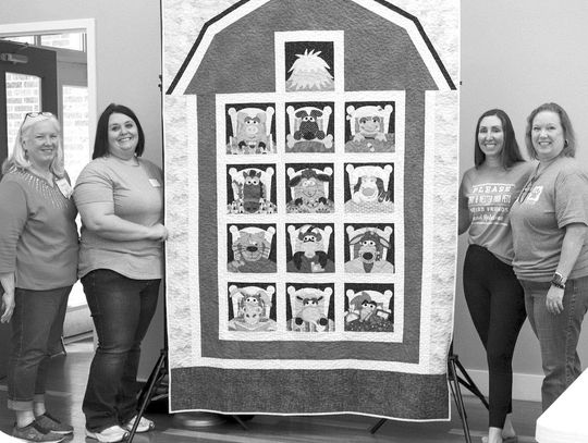 CVQG members donate quilt to animal shelter