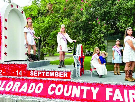 FAIR QUEENS SHOW FACE AT FAYETTE COUNTY FAIR PARADE