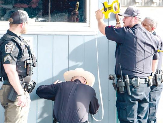 Gunfire outside vet clinic lands one in jail, wounded technician recovering