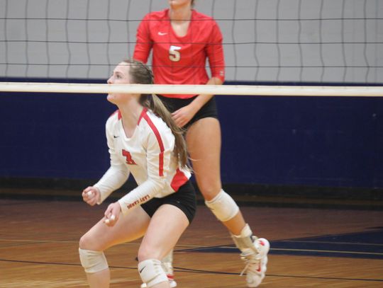 Senior libero Caylie Neisner watches the ball fly over the net before bumping it up to keep the point alive. Citizen | Evan Hale