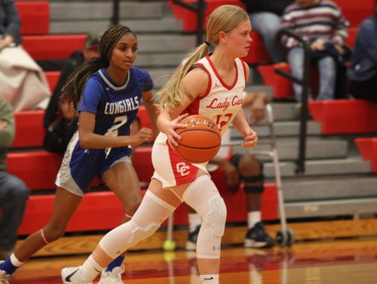 Karlee Mathis dribbling around her defender making her way to the basket. Citizen | Trent Whiting