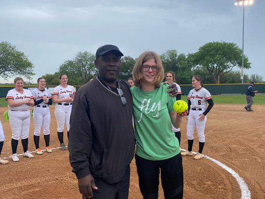 Softball team dedicates game, first pitch to Turtle Wing