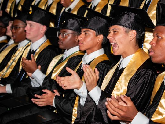 TCA graduates cross the stage in victory gold