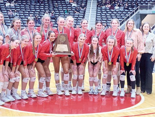 The Lady Cards posing with the State Semi-Finalist Trophy after the game. Citizen | Evan Hale