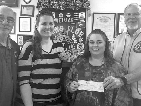 WEIMAR BAND GETS DONATION FROM LIONS