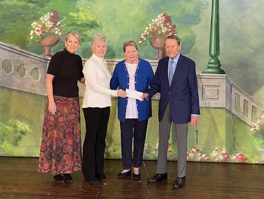 Pictured from left are Melissa Parker, Julie Prause, Judi Johnson and Jack Johnson standing on the Opera House stage. Courtesy photo