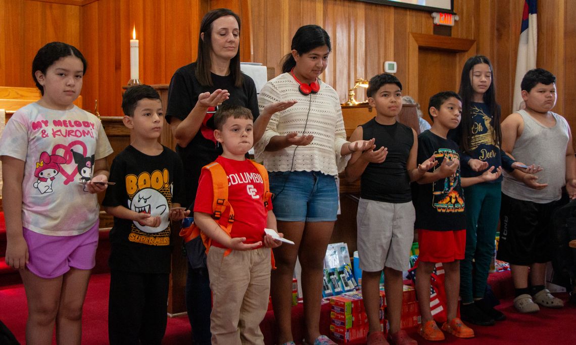 Church blesses students, eases back-to-school burden Church blesses students, eases back-to-school burden