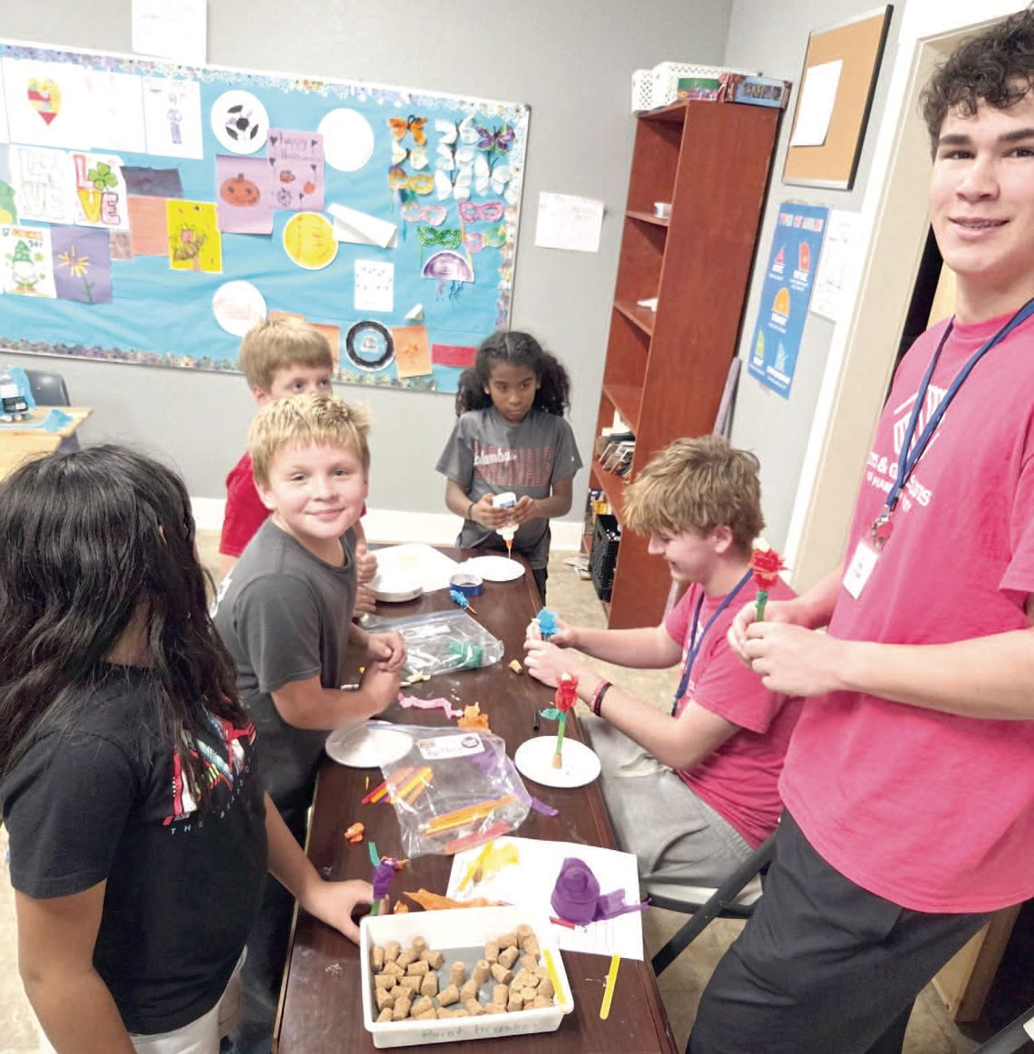 CLUB MEMBERS WORK ON PAPER TULIP CREATIONS