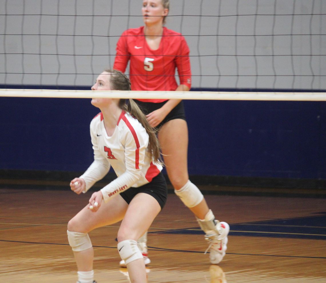 Senior libero Caylie Neisner watches the ball fly over the net before bumping it up to keep the point alive. Citizen | Evan Hale