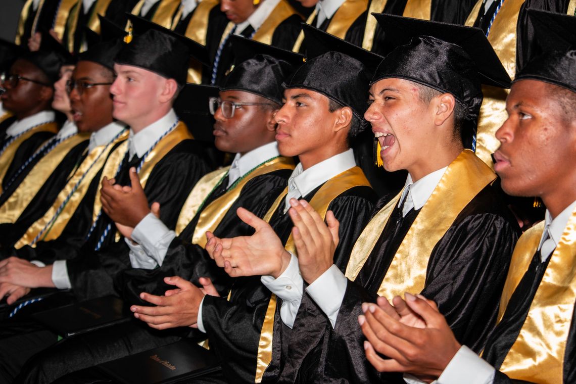 TCA graduates cross the stage in victory gold