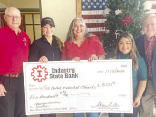 First United Methodist Church’s Share Your Christmas Program – Mazac (left), Heather Thomas, Sunshine Reyes, Yarley Penaloza and Kuehn.