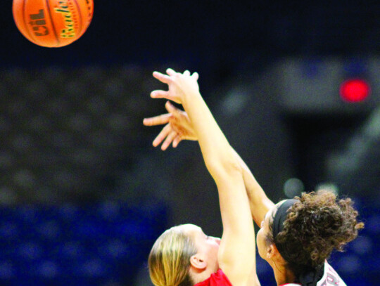 Ally Tribe battles for the jump ball with Holliday’s Jalynn Bristow.