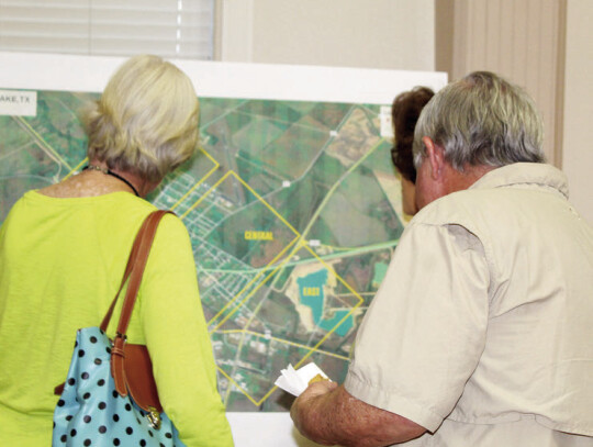 Attendees view the trail map.