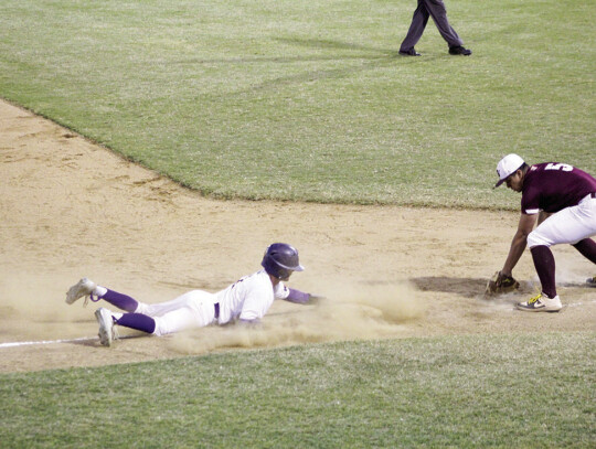 Derek Rees sliding into third base.