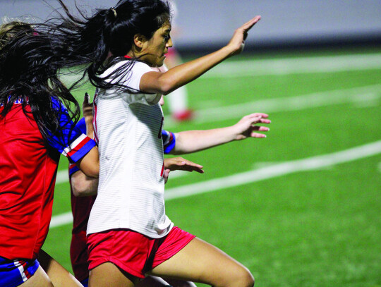 Karina Rubio tries to break through the Brazosport back line.