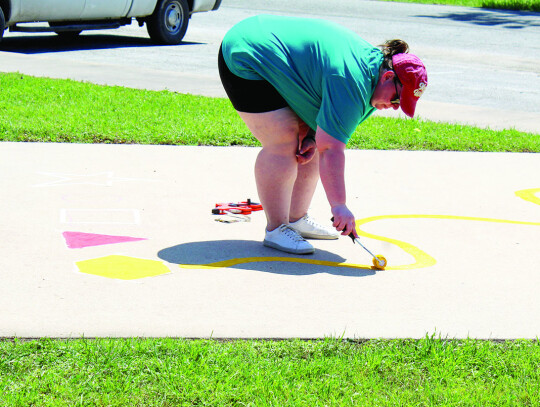 Jana Moffett painting squiggly game.