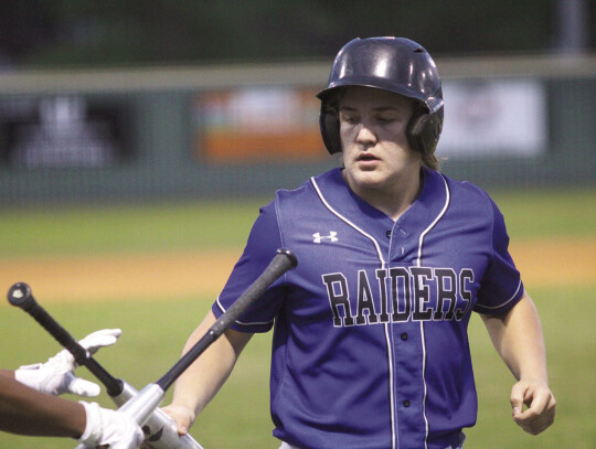 Gavin Tate heads back into the dugout following his at-bat.