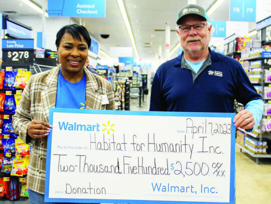 A $2,500 donation was presented to the Colorado County Habitat for Humanity: Walmart Store Manager Montraie Baldwin White and Habitat Board President Steve McCullough. Citizen | Shayla Kuykendall