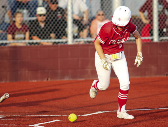 Karlee Mathis takes off and reaches base safely on a short bunt attempt.