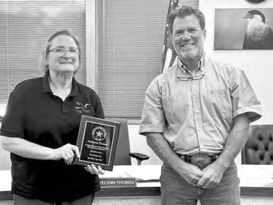 Councilwoman GayeLynn Thomas receiving plaque recognizing service from Mayor Tim Kelley.