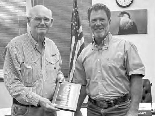 Outgoing Councilman Michael Cooper receiving plaque recognizing service from Mayor Tim Kelley.