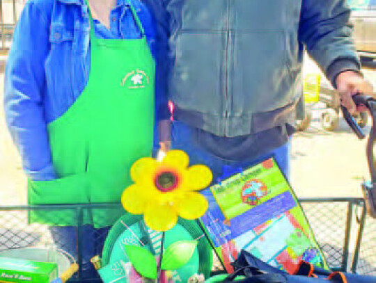 Eddie Pavliska and Ann Pavliska with garden cart