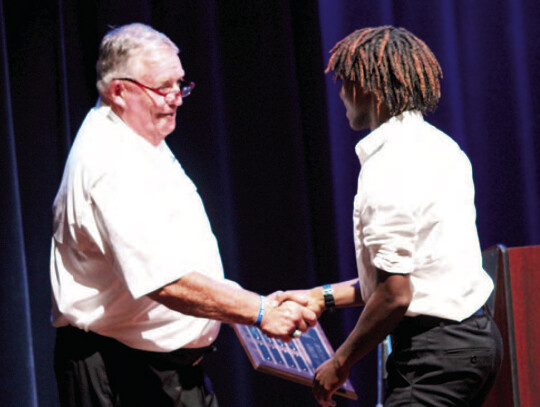 AD Brad Dumont awards the overall boys’ MVP to Kejun Wilson