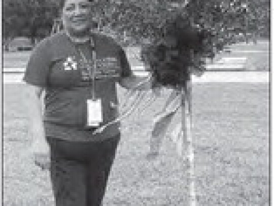 Elma Rodriguez, Community in Schools Site Coordinator next to Drae’dyn’s Tree. Courtesy photos