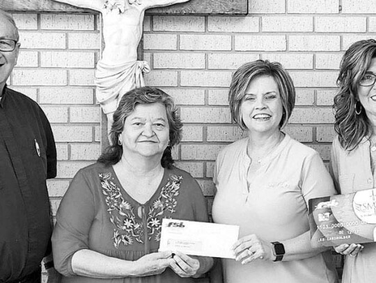 Fayette Savings Bank with St. Michael School officials – Father Wayne Flagg (left), Judy Roeder, SMS principal, Jennifer Moring, FSB Weimar branch manager, and Shannon Rosenauer, FSB personal banker.