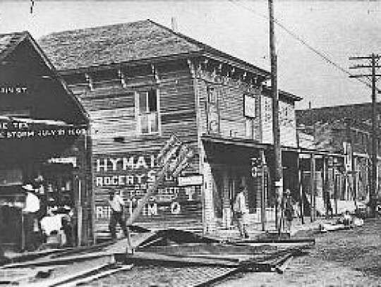 The historic old “Blue Store” is shown in a postcard from the 1909 storm. Main Street was heavily damaged. The store was built by Dr. B.C. Jones around 1865. He had a pharmacy and general store on the first floor, and a large hall on the upper, which 