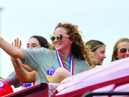 The Ladycats while on their fire truck victory parade through Weimar with Bevin Brenner in the front, Ericka Billeck behind her to the left and Lilly Berger and Rylee Noska to her right. Citizen | Trenton Whiting