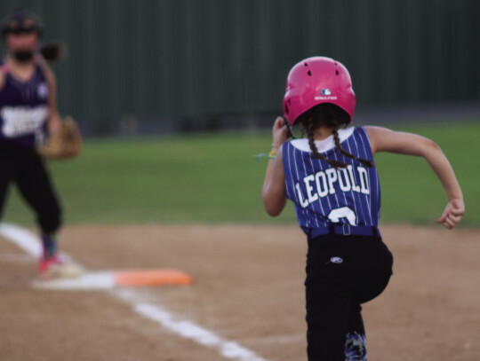 Lexie Leopald runs to first after putting a ball into play.