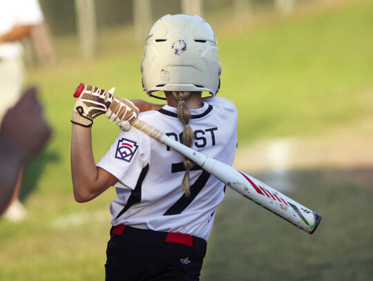 Hattie Post with a big swing at a pitch.