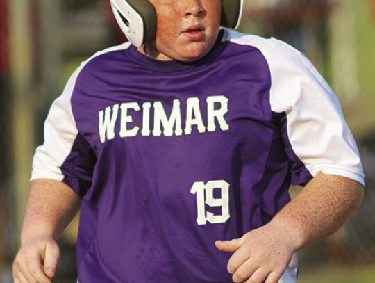 Brady Janecka runs home from third base.at the plate.