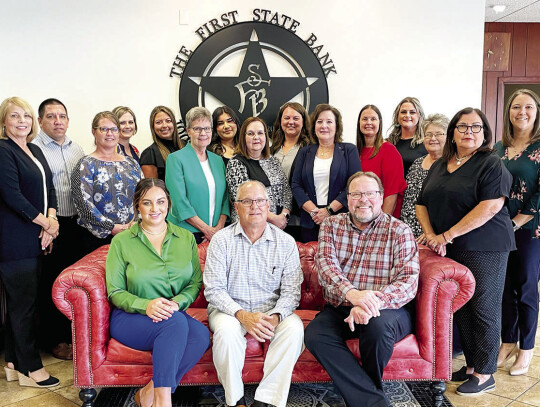 The First State Bank employees with years of service, from left: (on coach) Savanah Hill, customer service, 7 years, Patrick C. Moeller, chairman of board, president, CEO, CFO, 36 years, John J. Polach Jr., vice president, 18 years, (back row) Barbara Bar