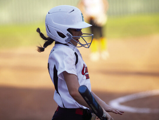 Far left: Andie Melnar playing for the Columbus softball Major league team. Left: Nhyla Cardenas rounds third to head to home plate. Citizen | Trenton Whiting