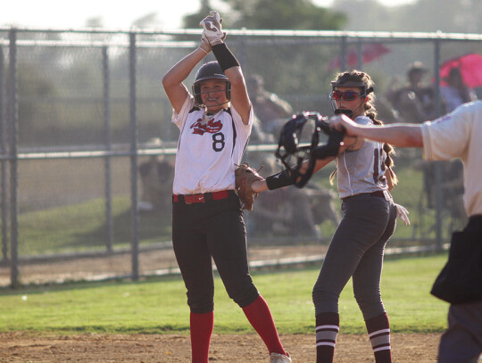 Eden beats the throw at third after a big triple to put herself into scoring position.