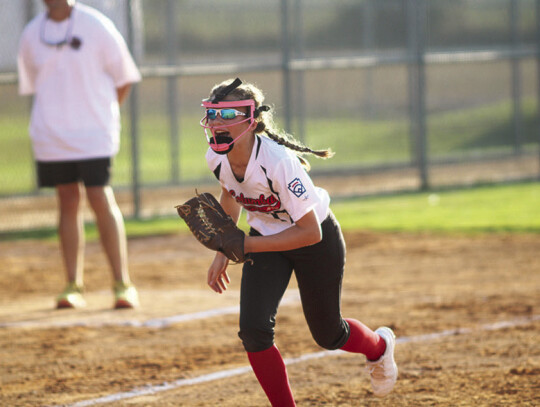 Andie Melnar pushes up to cover the potential bunt attempt.