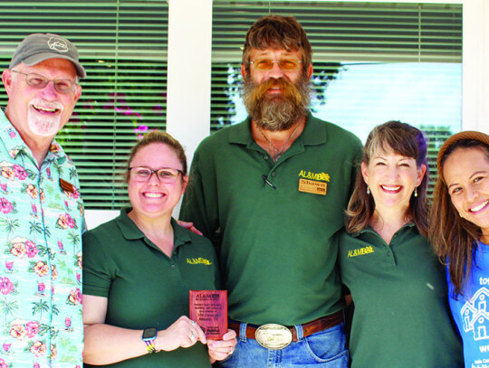 Colorado County Habitat for Humanity gave out plaques to donors and volunteers who helped with the home. Pictured is Construction Manager Scott Mattingly, AL&M representatives Diedra Lamb, Shawn Clapper, Alison Korell, and Executive Director Charmaine Katz.