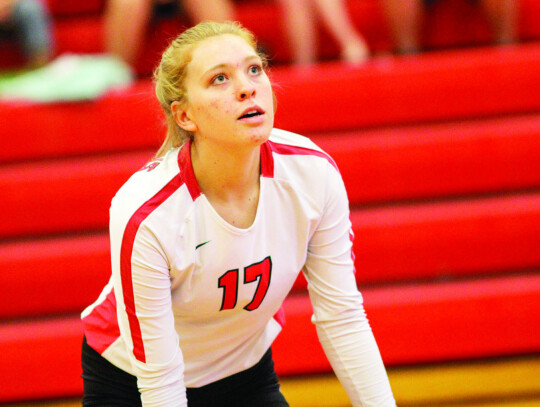 Claire Klausmeyer provides a strong presence at the net for the Columbus defense. Citizen | Trenton Whiting