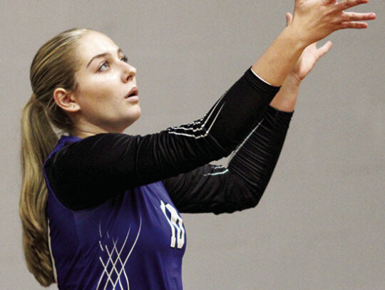 Adalyn Rogers serves for the Lady Raiders.