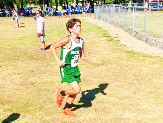 Eighth grader Dayson Mace of Weimar’s St. Michael Catholic School participates in a cross-country meet in Yoakum on Aug. 19.