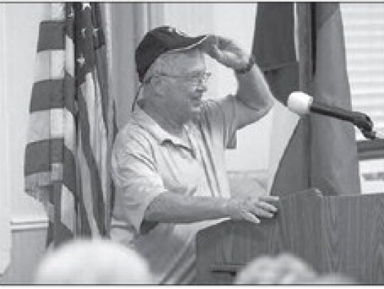 Charles Abel led the Pledge of Allegiance along with several other veterans that were present.