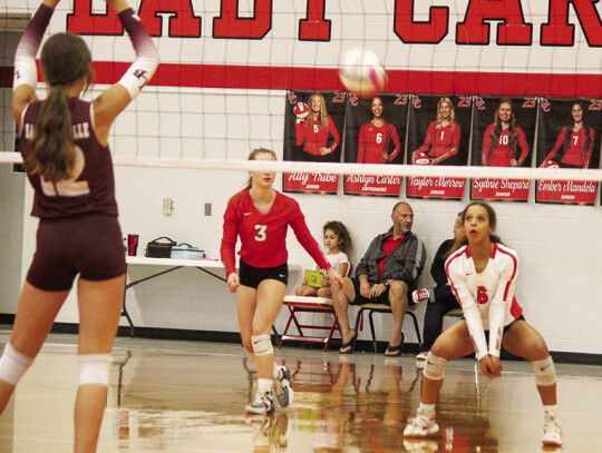 Sophomore defensive specialist Ashlyn Carter bumping the ball up to help set up a spike from Ally Tribe.