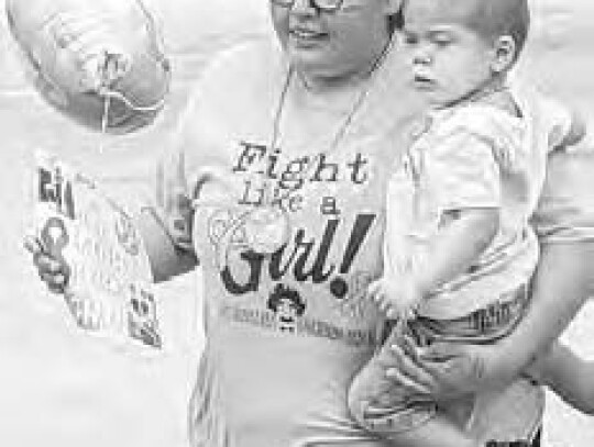 Pictured here is Brailyn Coronado holding Kannon during the parade.