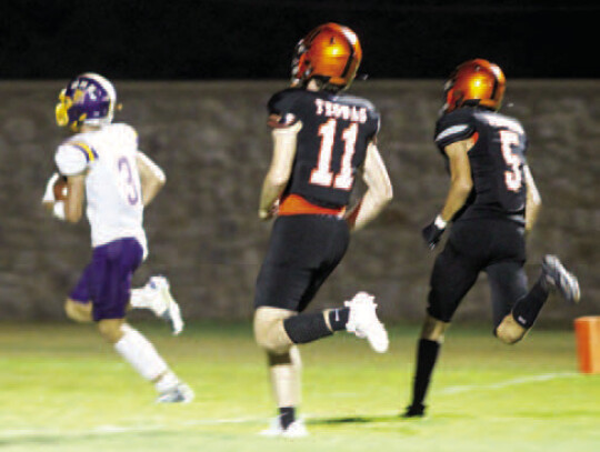 Junior running back Zach Norrell running into the endzone to extend the lead for the Wildcats.