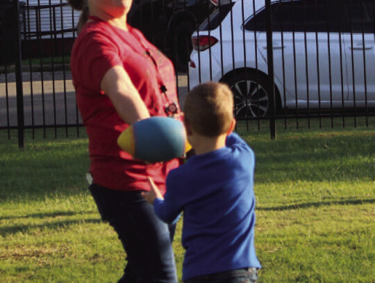 BOTTOM LEFT: Teacher Amber Kuhn played games with the students during the Fall Festival.